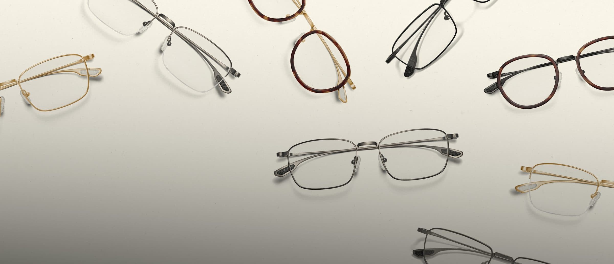ROKA optical frames in gold, gunmetal, black and tortoise scattered across a cream backdrop.